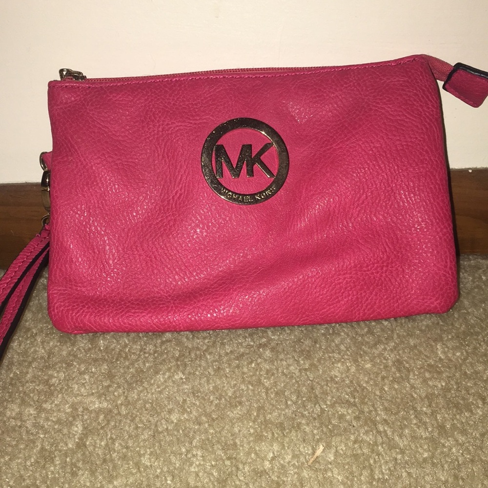 Lightly used pink {Micheal Kors} wristlet
